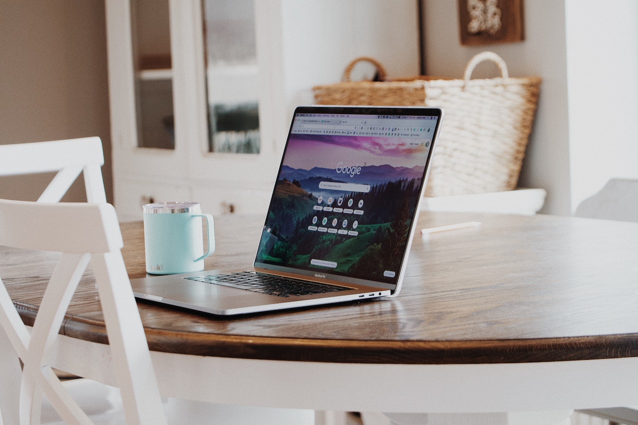 A laptop on a kitchen table